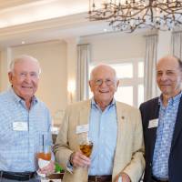 Three men posing for a photo at Naples 2019